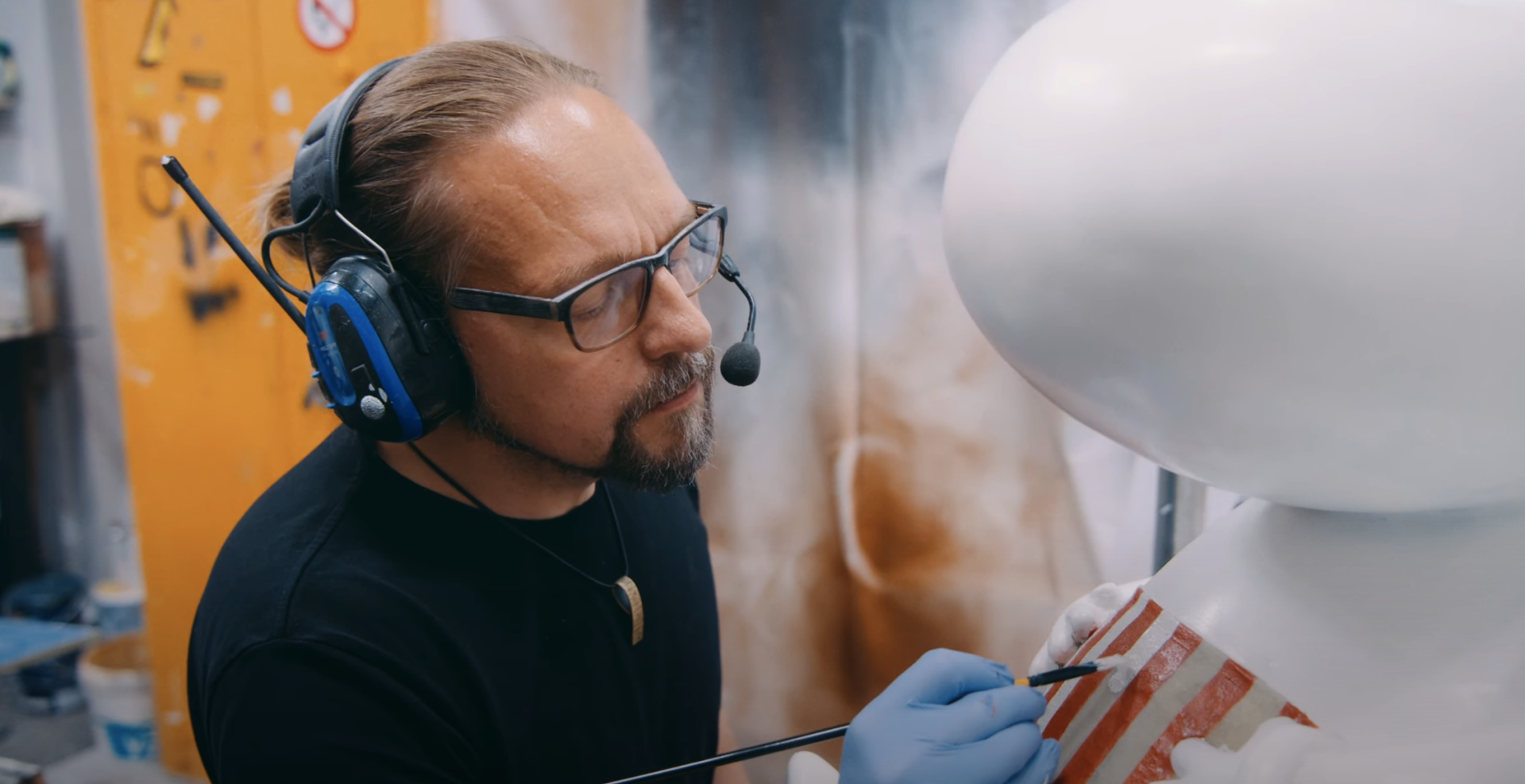 A Junibacken craftsperson creating the Moomin playground
